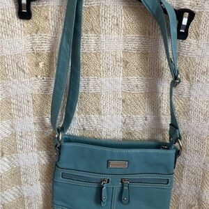 Blue Crossbody Bag with Adjustable Strap and Streamlined Design